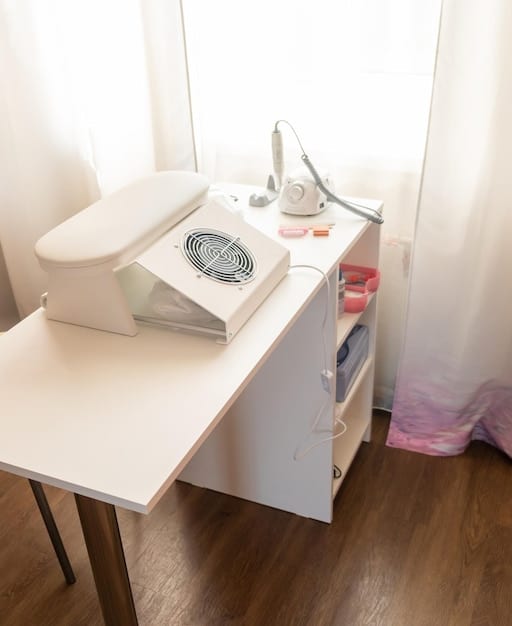 A neatly organized laundry room with a front-load washing machine and dryer. The room is well-lit and features storage shelves stocked with laundry supplies, exemplifying an efficient and aesthetically pleasing laundry space.