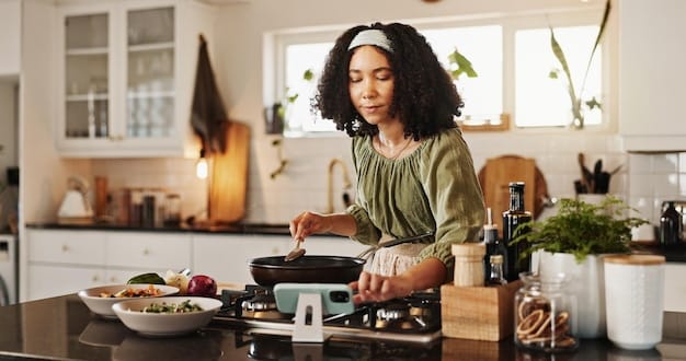 A US mom smiling while preparing healthy meals in her kitchen with the help of meal prep containers and a slow cooker