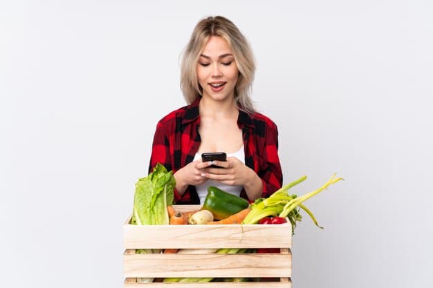 A woman happily checking items off a grocery list on her phone while pushing a shopping cart filled with fresh produce and healthy ingredients in a well-lit grocery store.