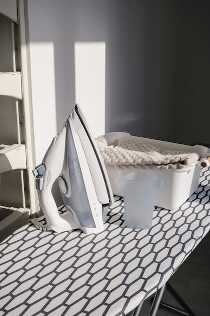A brightly lit laundry room with an efficient folding station, featuring a large countertop for folding, organized shelving with labeled baskets for different clothing types (socks, underwear, etc.), and a hanging rack for freshly ironed shirts. The room is painted in calming pastel colors, creating a serene and functional space.