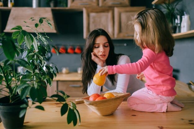 A mom is shown in her kitchen on a Sunday afternoon, happily chopping vegetables. She has several containers of prepped ingredients around her, ready to be used for quick weeknight dinners. The kitchen is clean and organized.