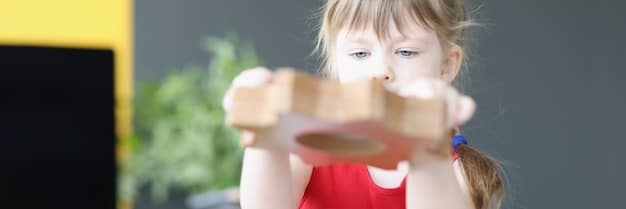 A toddler engrossed in playing with a set of wooden blocks, demonstrating focused engagement during playtime achieved through toy rotation.