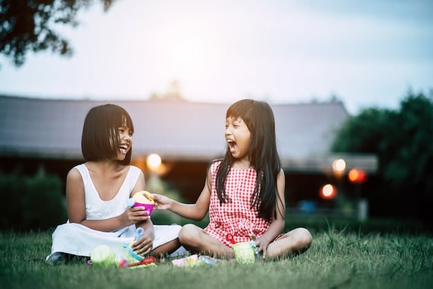 Three siblings playing harmoniously together, smiling and laughing in a backyard setting.