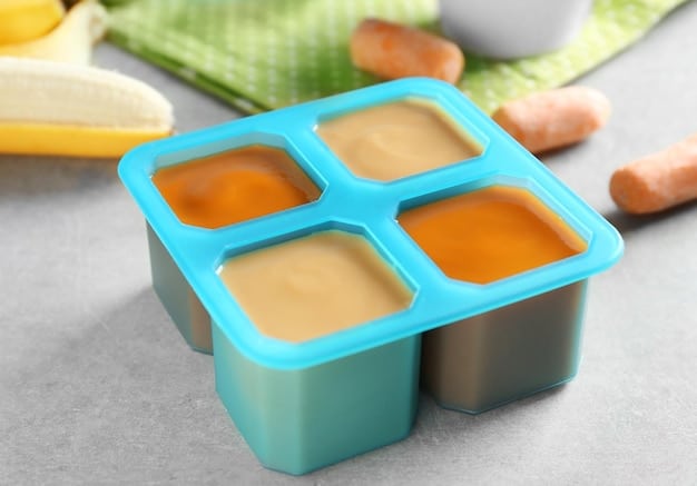 A freezer neatly packed with various containers of labeled baby food purees, emphasizing organization and proper storage practices.
