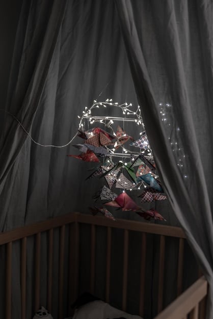 A well-organized nursery with blackout curtains, a white noise machine, and a comfortable crib, showcasing an ideal sleep environment for a baby or young child.
