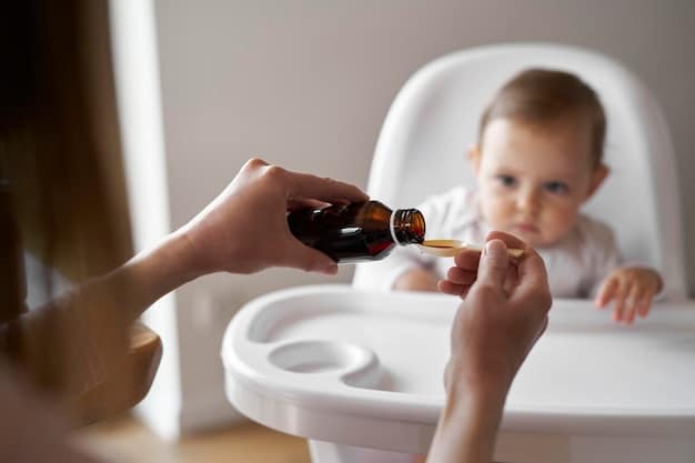 A close-up shot of a parent administering vitamin D drops to their baby using a dropper.