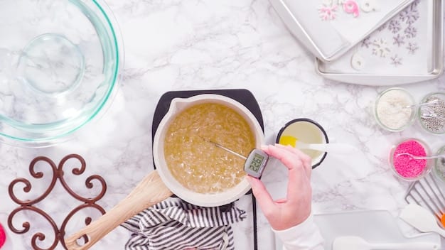 A digital food thermometer inserted into a bowl of baby food puree, illustrating the importance of checking the temperature for safety before serving to a baby.