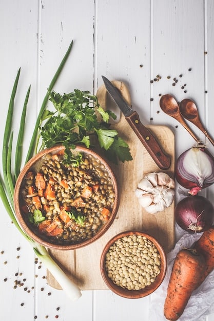 Stock photo of beans and lentils with some veggies as a side.
