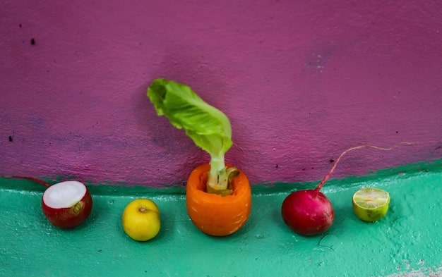A colorful collage featuring various fruits and vegetables known to help relieve constipation in babies, such as prunes, pears, broccoli, and plums. Each food is clearly labeled.
