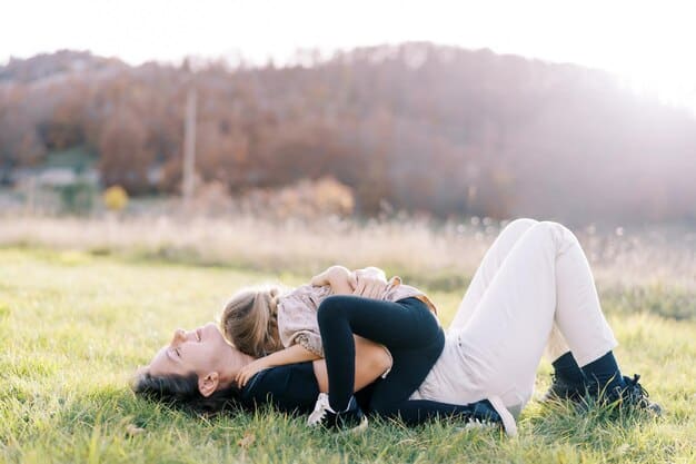 A peaceful scene of a mom lying on the grass with her eyes closed, practicing a body scan meditation, while her children play quietly nearby. The image suggests incorporating mindfulness into everyday outdoor activities and balancing personal well-being with family time in a natural setting.