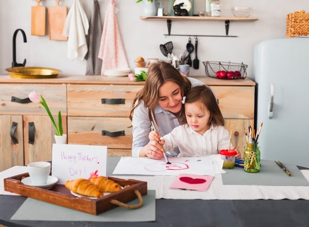 A mother laughing with her child while they paint together at a kitchen table. The atmosphere is warm and playful, illustrating bonding and creative expression as forms of self-care.