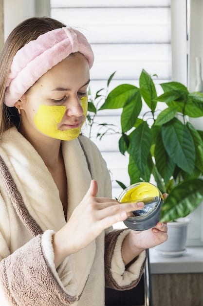 Close-up of a woman applying a homemade face mask in her bathroom. The ingredients are visible on the counter, showing the natural and affordable aspect of the spa day.