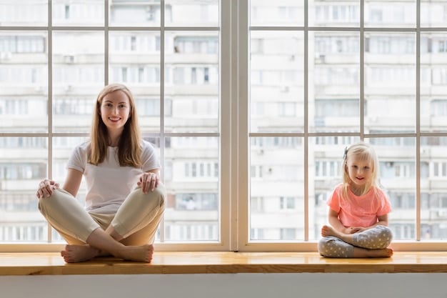 A mother sitting cross-legged on a yoga mat in a quiet room, eyes closed, meditating peacefully with soft sunlight streaming in through the window.