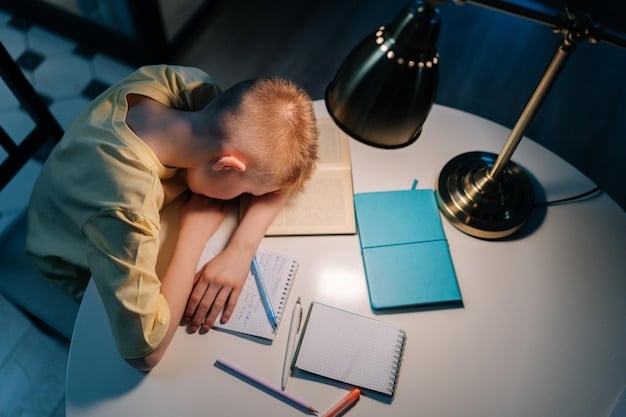 Image of a tired child struggling to stay awake in a classroom, highlighting the negative impact of sleep deprivation on academic performance and learning abilities.