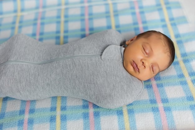 A close-up of a baby properly swaddled in a lightweight, breathable fabric. The swaddle is snug but allows for hip movement. The baby appears calm and peaceful.