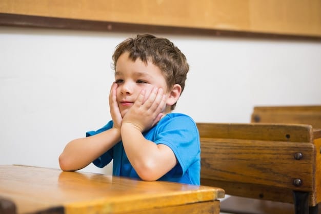 A close-up shot of a child yawning while sitting in a classroom. The child looks visibly tired, with droopy eyes and a weary expression.