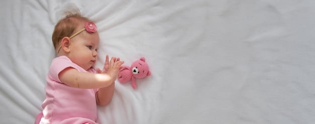 A baby lying awake in a crib, looking content and relaxed with a soft toy next to them. The room is dimly lit and calming.