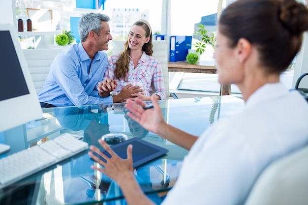 A family discussing healthcare finances with a financial advisor in a bright, modern office setting.