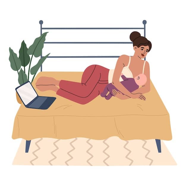 A mother breastfeeding her baby in bed in a side-lying position. The bed is clear of clutter, with only a thin blanket covering the mother, and the baby is close to the mother's chest.